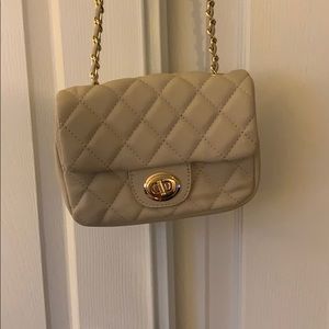 VICI cross body quilted purse.
